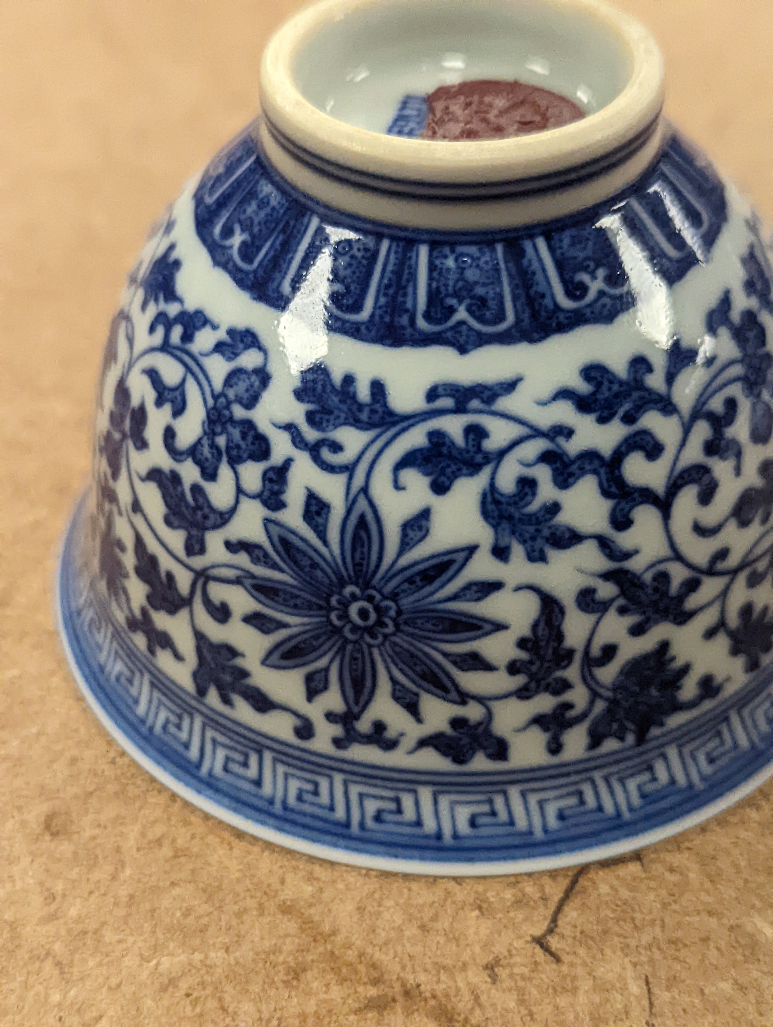 A Chinese blue and white 'lotus' cup. 9cm diameter